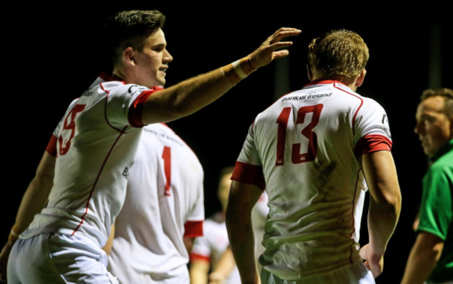 Michael Courtney is congratulated by teammate James OÕDonovan