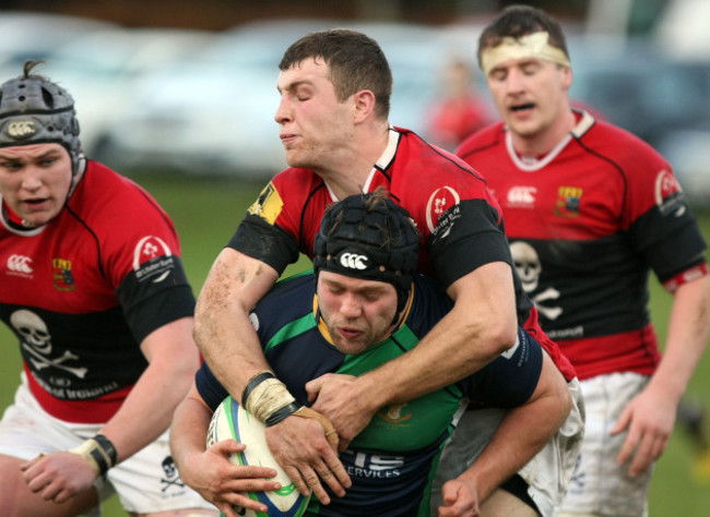 Johnny Murphy is tackled by Conor Barry