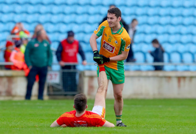 Ian Burke helps Donie Newcombe