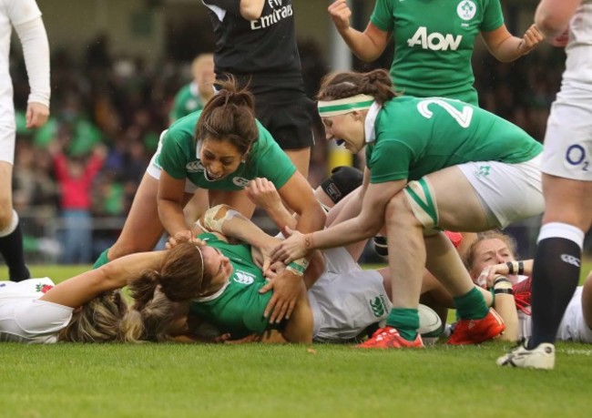 Ireland&Otilde;s Sene Naoupu and Chloe Pearse celebrates with try scorer Nora Stapleton