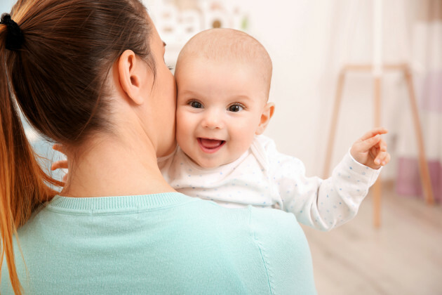 Person Holding A Baby - acclaimedmoms