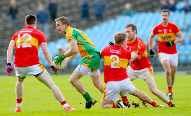 James Durkan, Shane Irwin and Shane Hopkins tackle Gary Sice