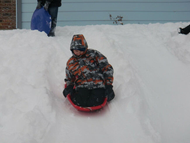 Boy Sledding