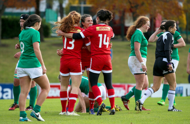 Julianne Zussman celebrates scoring a try with Alexandra Tessier and Elissa Alarie