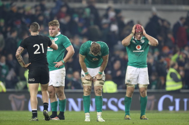 Finlay Bealham, Jamie Heaslip and Josh van der Flier dejected after the game