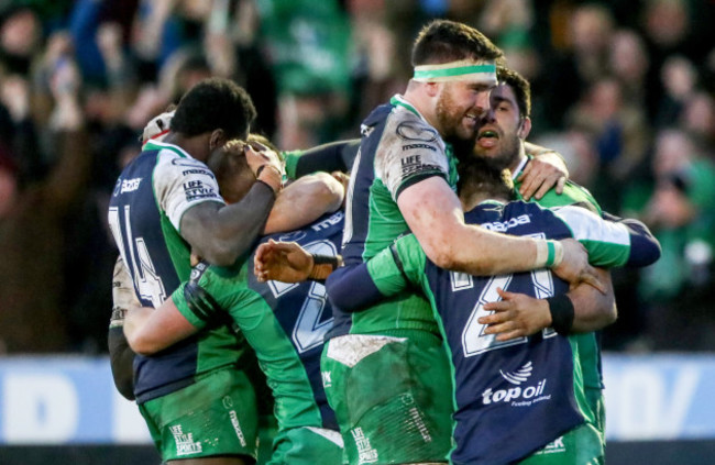 Andrew Browne, Ronan Loughney and Caolin Blade celebrate after the game