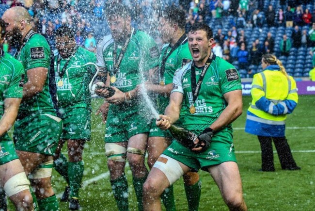 Robbie Henshaw celebrates with champagne after the game