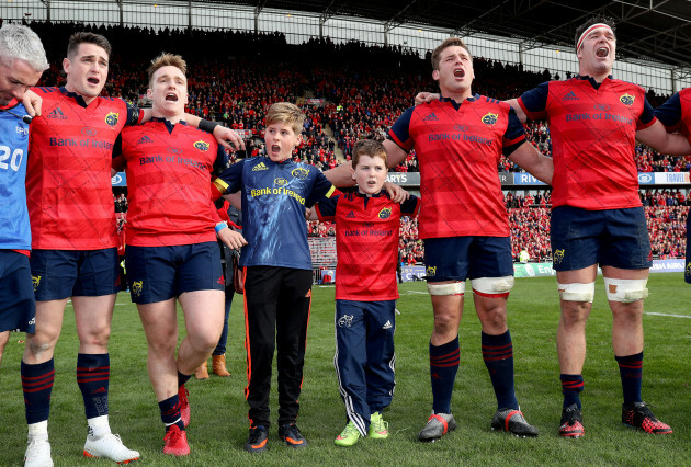 Tony and Dan Foley, sons of the late Anthony Foley sing with the Munster players after the game