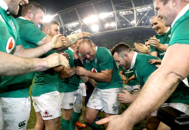 Rory Best celebrates with teammates after the game