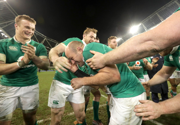 Rory Best is congratulated by teammates after the game