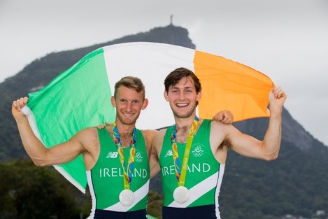 Gary and Paul O'Donovan celebrate winning a silver medal