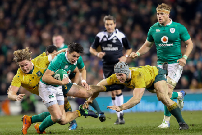 Michael Hooper and David Pocock tackle Joey Carbery