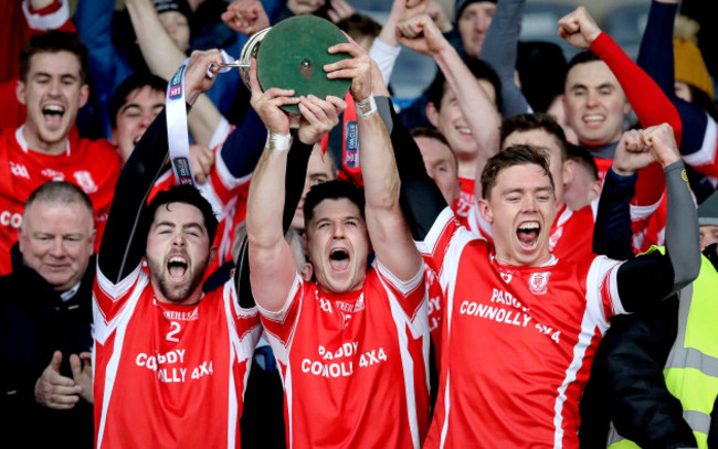 Oisin Gough, David Treacy and Paul Schutte lift the trophy