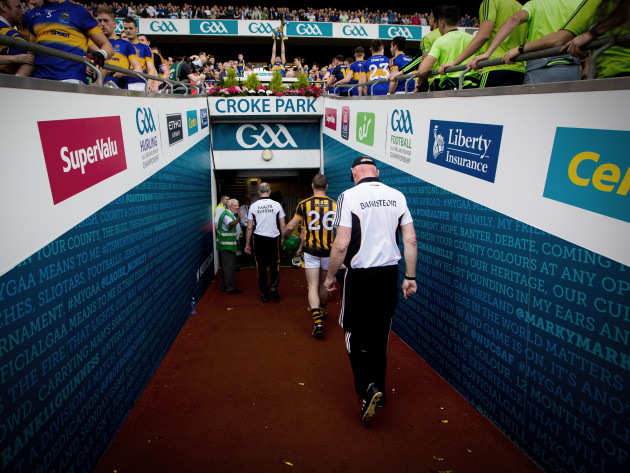 Brian Cody leaves the field as Tipperary players lift the trophy