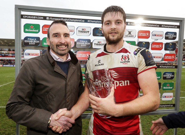 Iain Henderson is presented with the Man of the Match award by Chris Mills