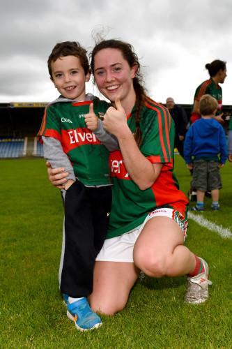 Doireann Hughes celebrates with a young Mayo fan at the end of the game