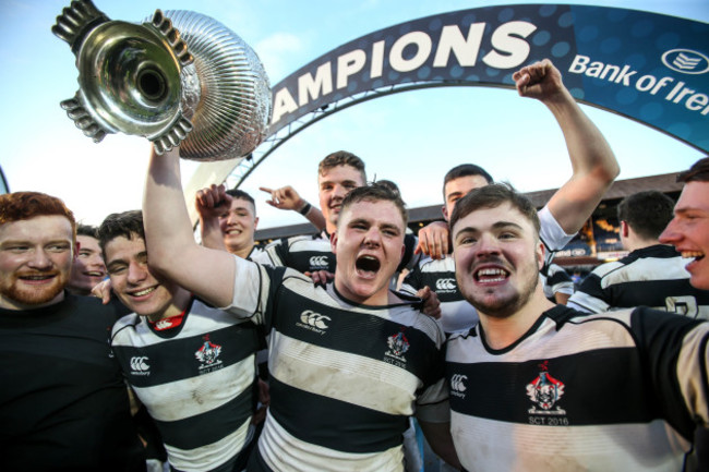 Belvedere players celebrate with the cup