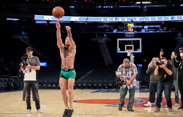 Conor McGregor scores a basket during his workout