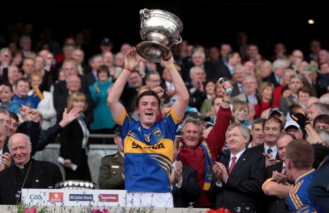 Liam McGrath raises the Minor trophy