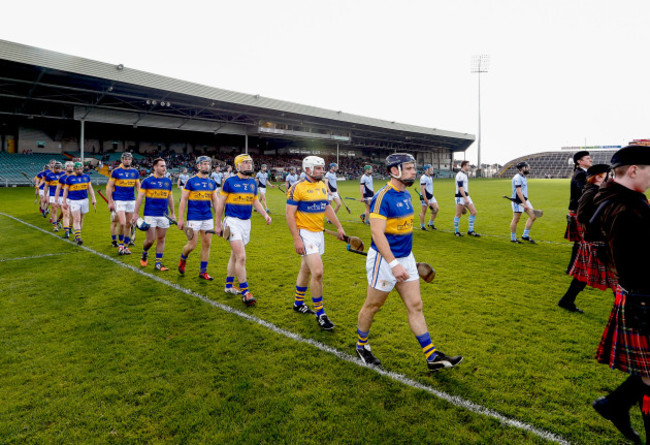 The two teams parade before the match