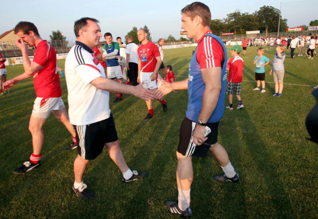 Kieran McGeeney and Aidan O'Rourke at the end of the game