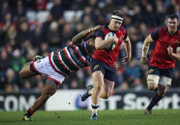 Rory Scannell is tackled by Manu Tuilagi