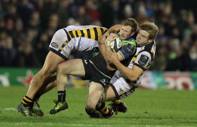 Kieran Marmion is tackled by Tommy Taylor and Joe Launchbury