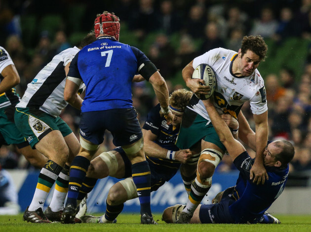 Jamie Heaslip and Devin Toner tackle Calum Clark