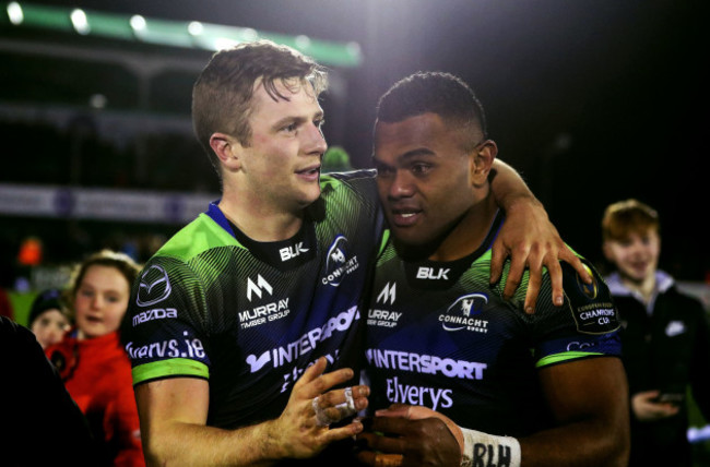 Jack Carty celebrates with try scorer Naulia Dawai after the game