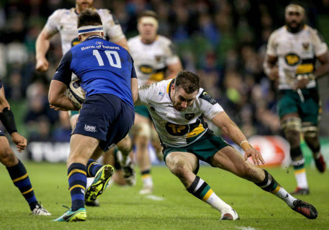 Ross Byrne tackled by JJ Hanrahan