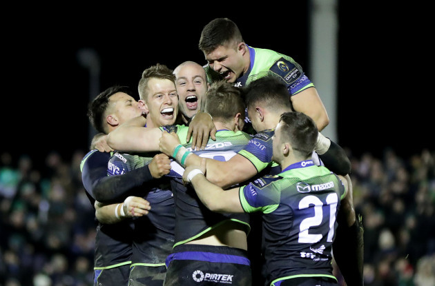 Connacht players celebrate with winning goal kicker Jack Carty