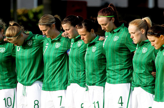 Members of the Irish team observe a minutes silence