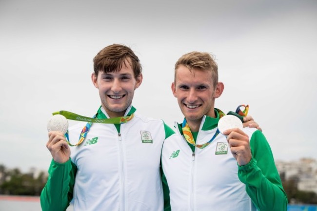 Gary and Paul O'Donovan celebrate winning a silver medal