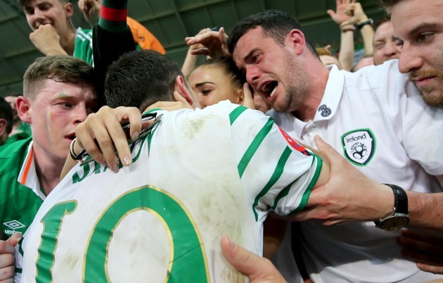 Robbie Brady celebrates with his girlfriend Kerrie Harris and his brother