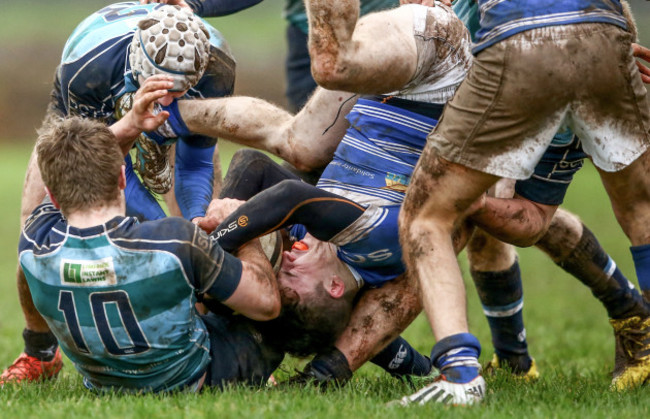 Stephen Atkinson and Conor Myers tackle Derry Gleeson