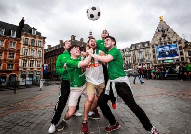 Irish fans play football in the Grand Place