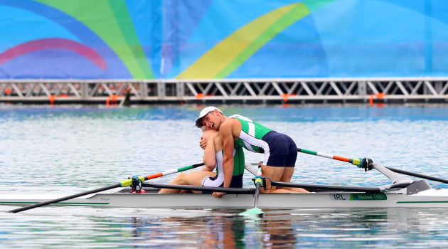 Gary and Paul O'Donovan celebrate winning silver medals