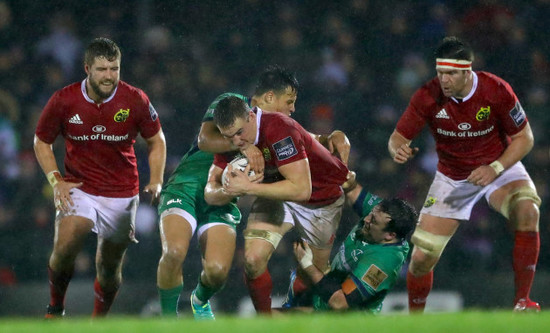 Rory Parata and Denis Buckley tackle Tommy O'Donnell