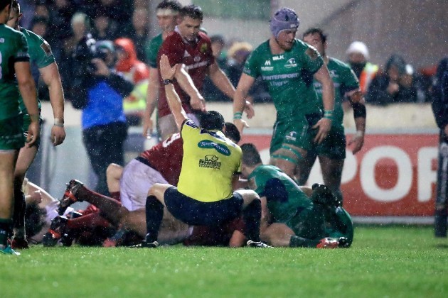 Dudley Phillips awards a try to Munster after Rhys Marshall got over the line