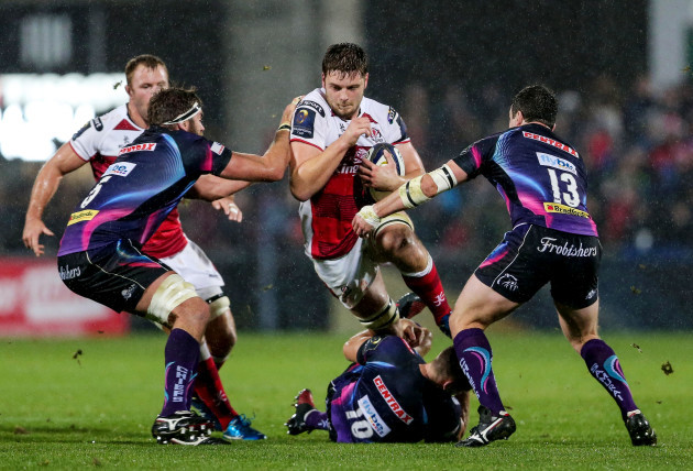 Iain Henderson is tackled by Gareth Steenson, Geoff Parling and Ian Whitten