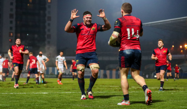 Billy Holland celebrates with Andrew Conway after he scored his sides third try