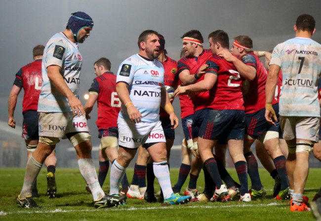 Billy Holland and CJ Stander celebrate with Niall Scannell after he scored his sides fourth try