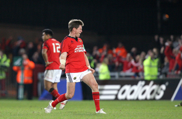 Ronan O'Gara celebrates after scoring a drop goal after 41 phases to win the game