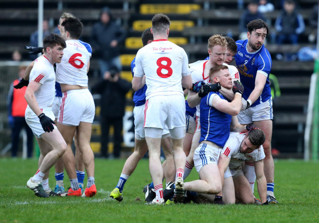 Tyrone and Cavan players clash during the game