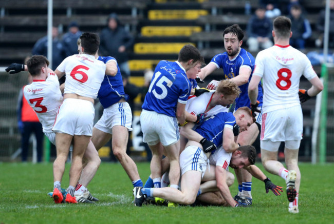 Tyrone and Cavan players clash during the game