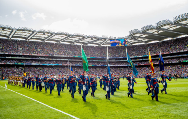 The teams parade before the game