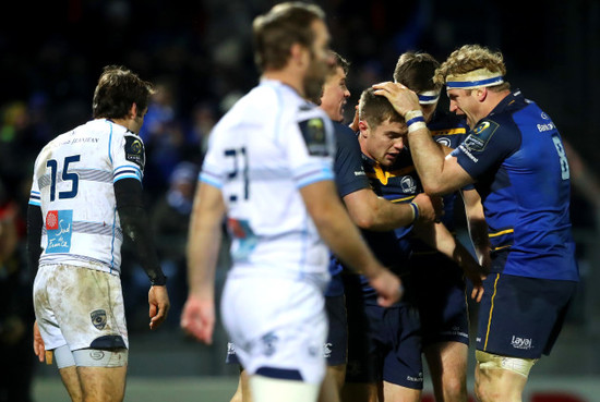 Luke McGrath celebrates his try with Jamie Heaslip