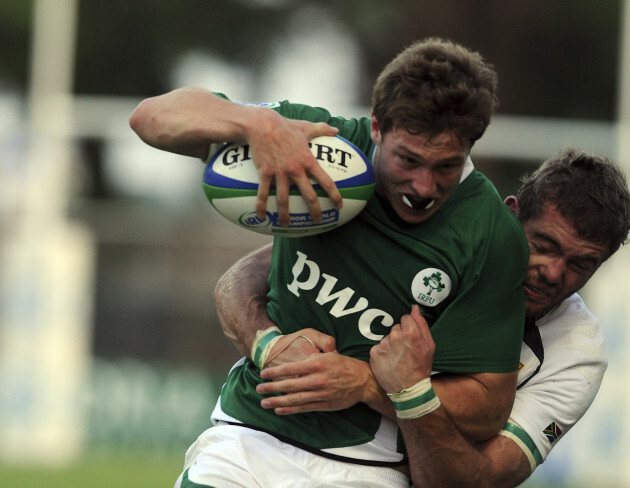 Brendan Macken is tackled by Jaco Taute