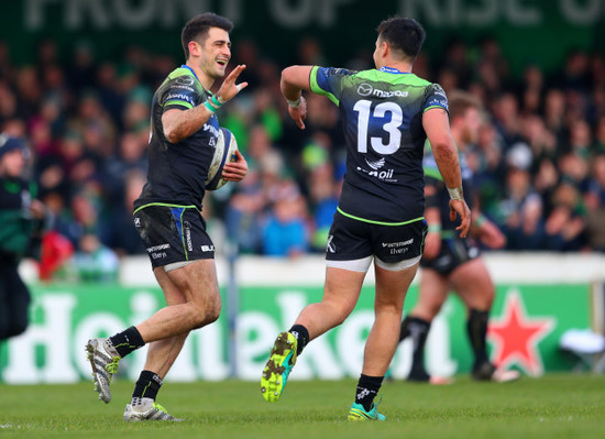 Tiernan O’Halloran celebrates scoring his sides third try with Rory Parata