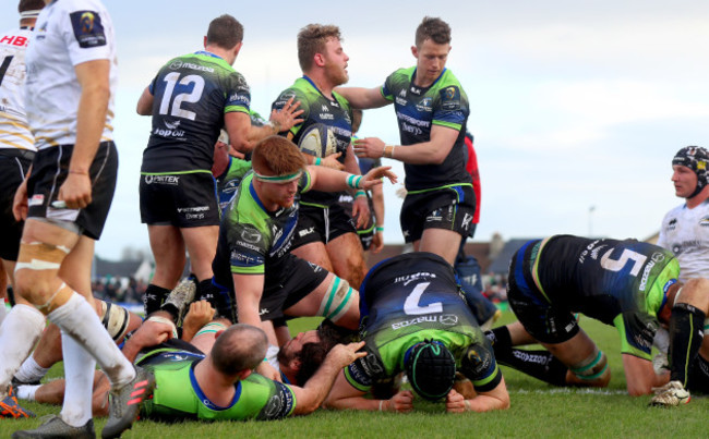 Craig Ronaldson and Matt Healy celebrate with try scorer Finlay Bealham